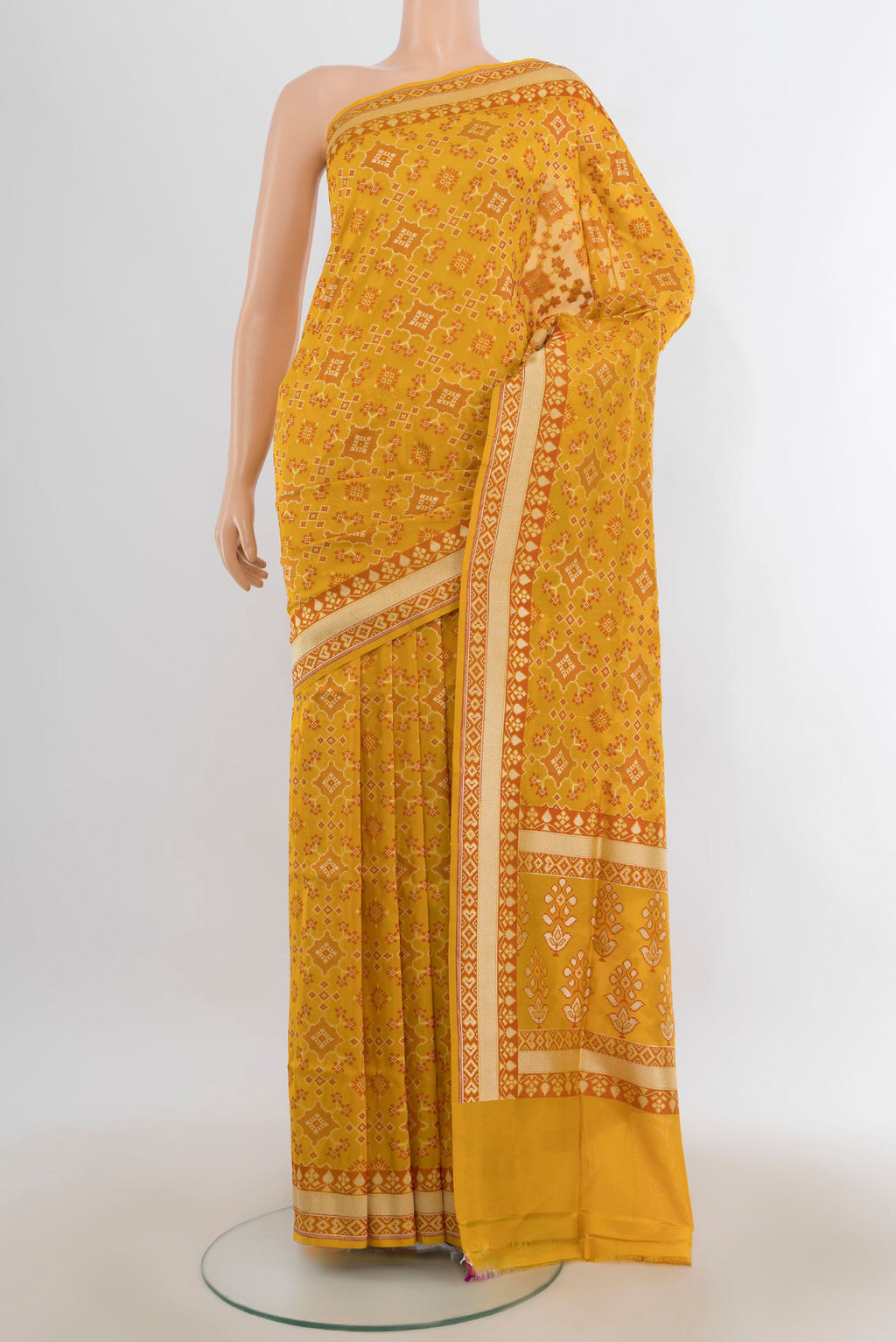 Pure Silk Yellow Banarasi Saree with Zari And Thread Butta on the body and Zari Border.  displayed on a mannequin