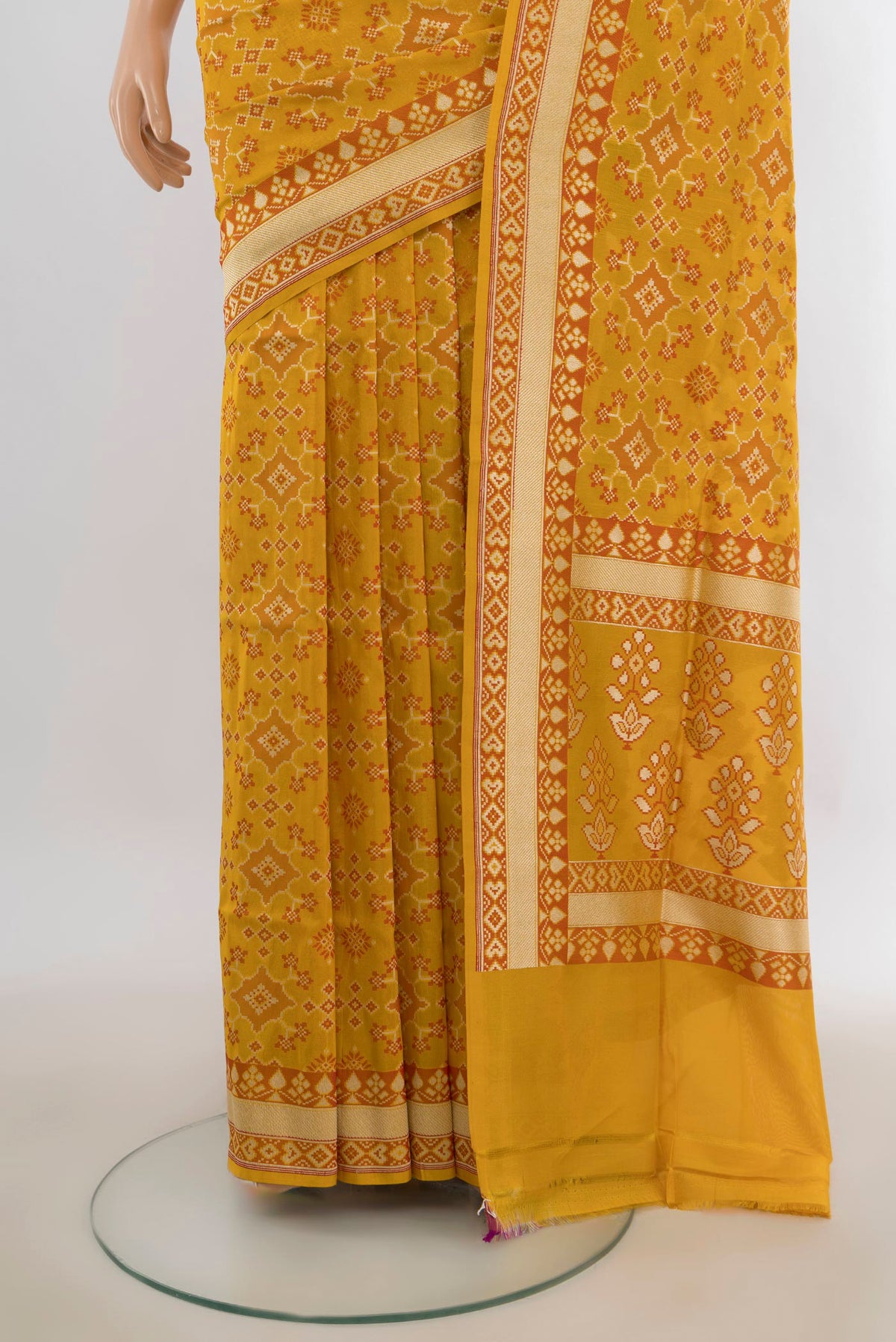 Pleats and pallu of Pure Silk Yellow Banarasi Saree with Zari And Thread Butta on the body and Zari Border. 