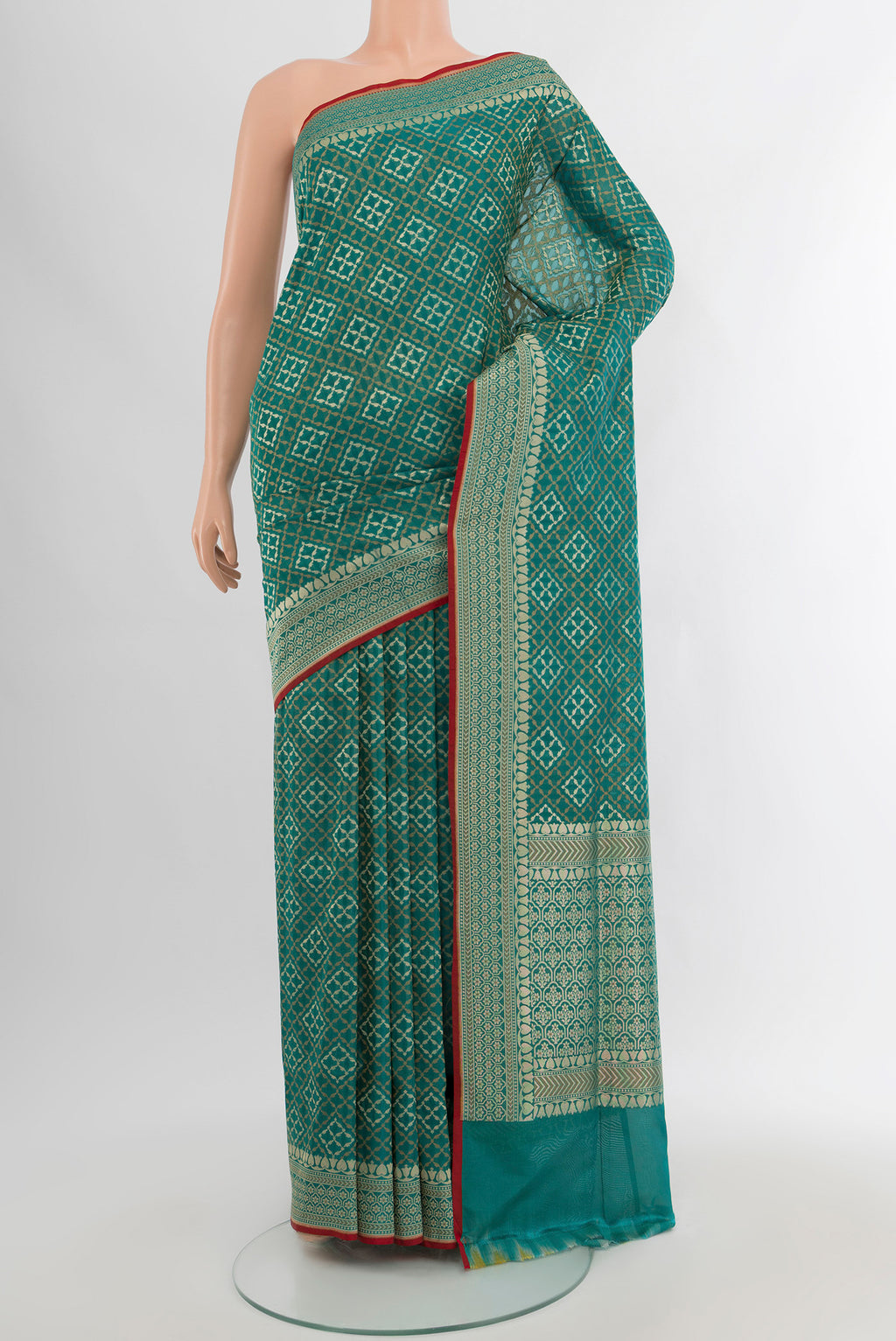 Peacock Blue Banarasi Silk Saree with Zari And Thread Butta on the body and Zari Border.  displayed on a mannequin