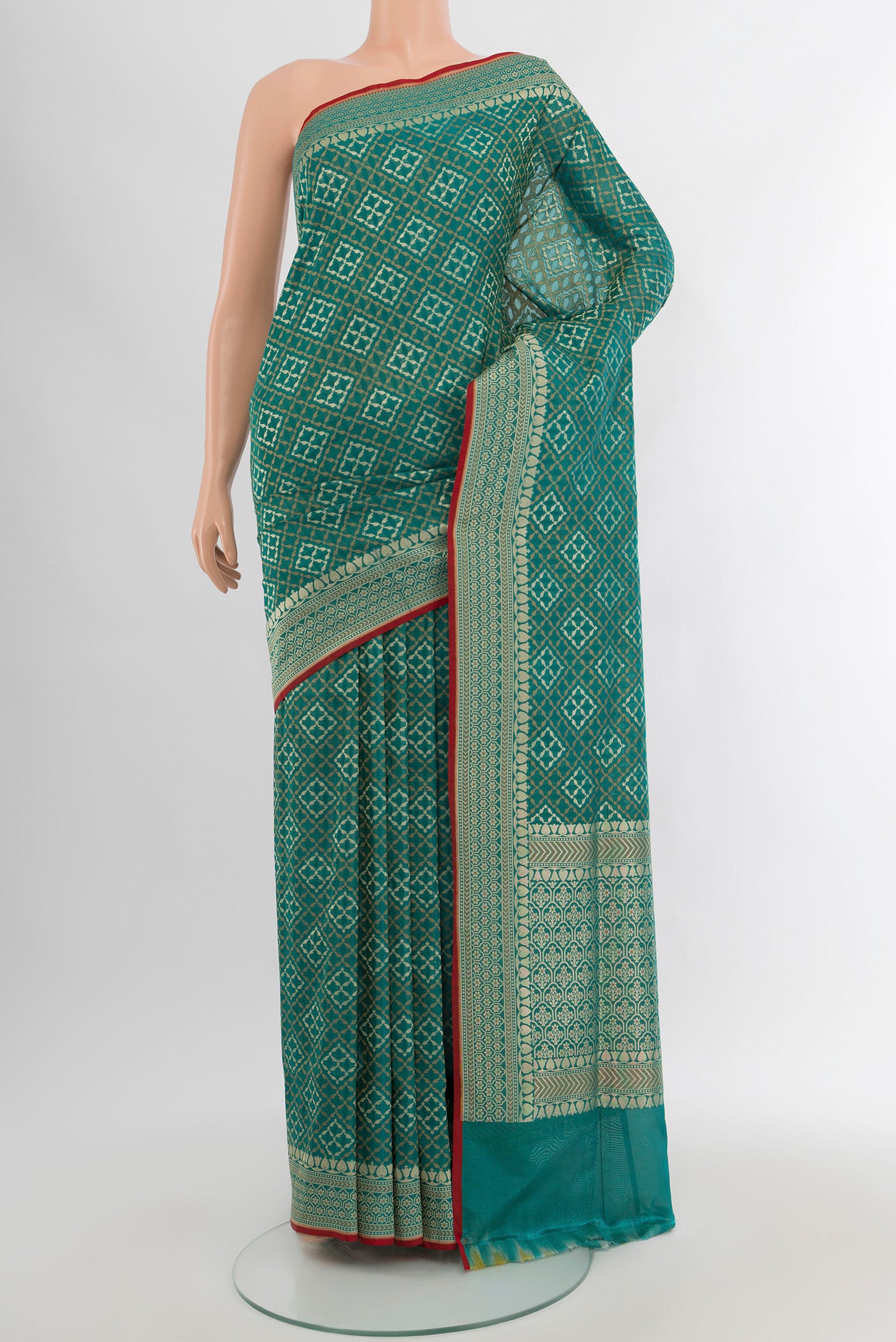 Peacock Blue Banarasi Silk Saree with Zari And Thread Butta on the body and Zari Border.  displayed on a mannequin