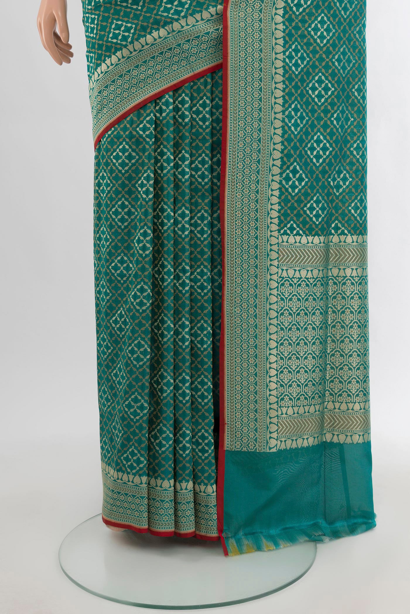 Pleats and pallu of Peacock Blue Banarasi Silk Saree with Zari And Thread Butta on the body and Zari Border. 