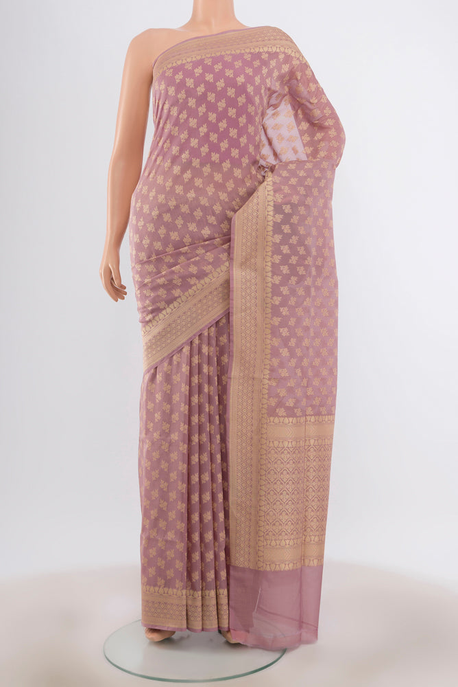 Bronze Banarasi Silk Saree with Zari Butta on the body and Silk Border.  displayed on a mannequin