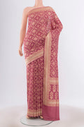 Bronze Banarasi Silk Saree with Zari Butta on the body and Silk Border.  displayed on a mannequin