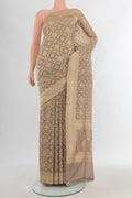 Grey Banarasi Silk Saree with Zari Butta on the body and Zari Border.  displayed on a mannequin