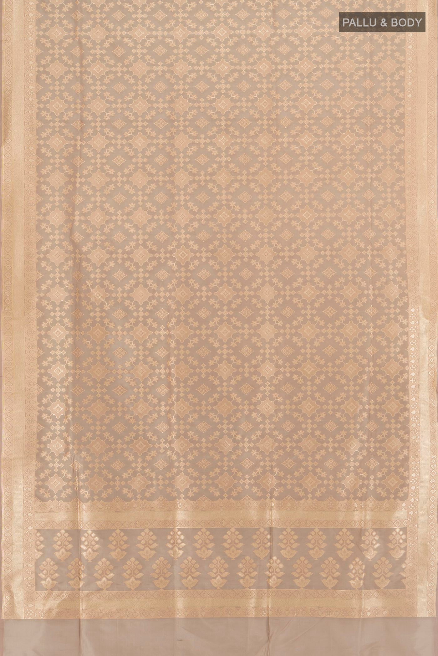 Flat view of Grey Banarasi Silk Saree with Zari Butta on the body and Zari Border. 