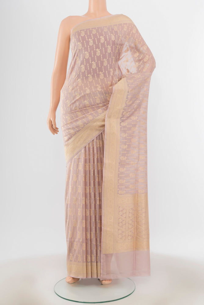 Bronze Banarasi Silk Saree with Zari Butta on the body and Silk Border.  displayed on a mannequin