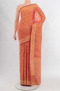 Peach Banarasi Silk Saree with Zari Butta on the body and Zari Border.  displayed on a mannequin
