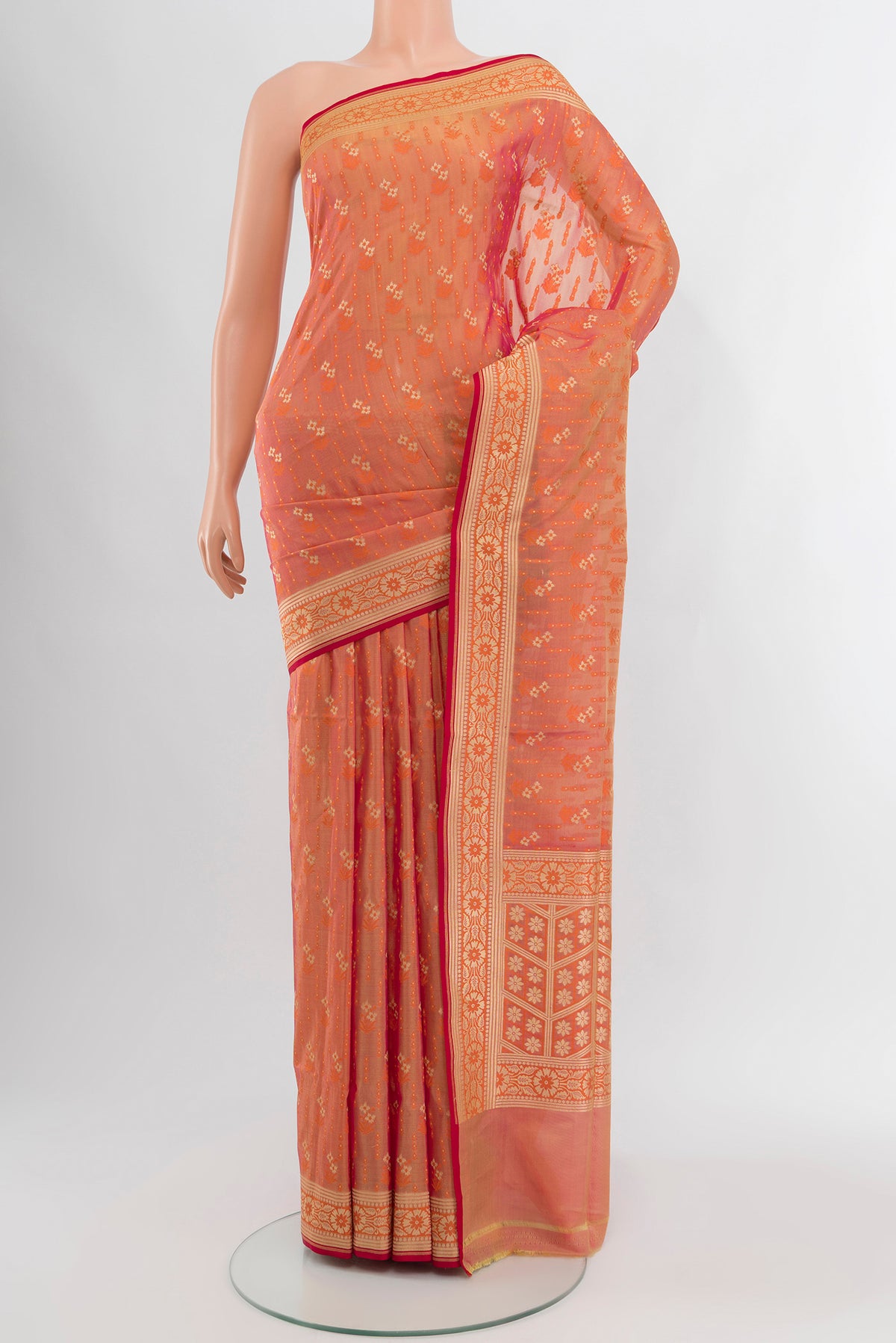 Peach Banarasi Silk Saree with Zari Butta on the body and Zari Border.  displayed on a mannequin
