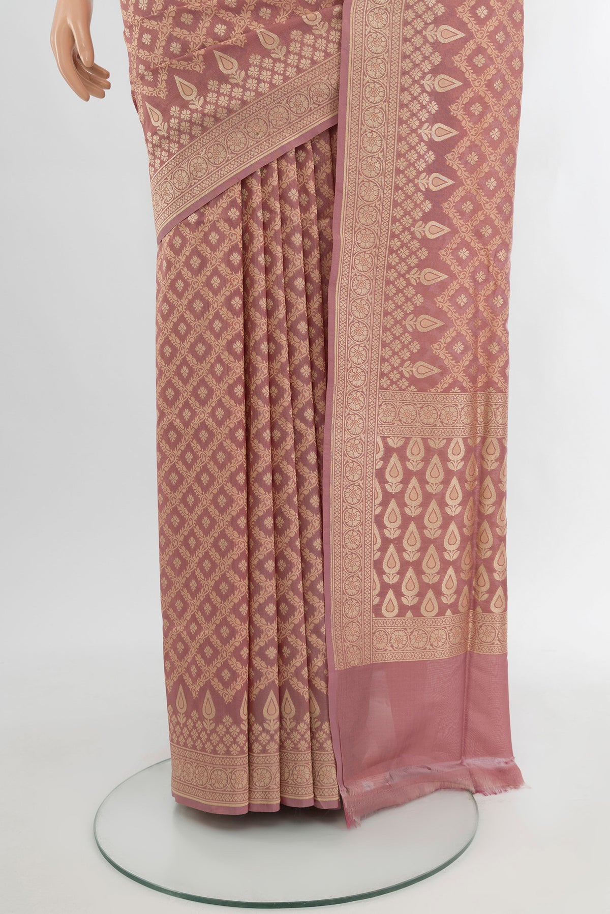 Pleats and pallu of Rose Gold Banarasi Silk Saree with Zari Butta on the body and Zari Border. 