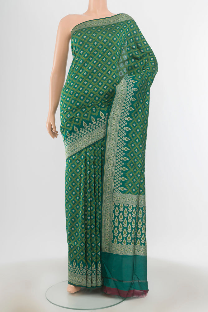Peacock Blue Banarasi Silk Saree with Zari Butta on the body and Silk Border.  displayed on a mannequin
