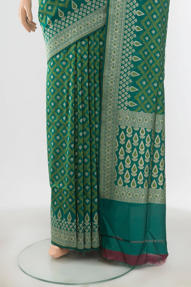 Pleats and pallu of Peacock Blue Banarasi Silk Saree with Zari Butta on the body and Silk Border. 