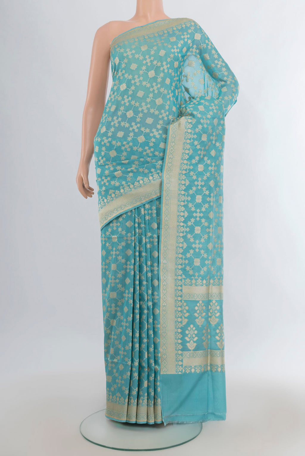Pure Silk Sky Blue Banarasi Saree with Zari Butta on the body and Zari Border.  displayed on a mannequin