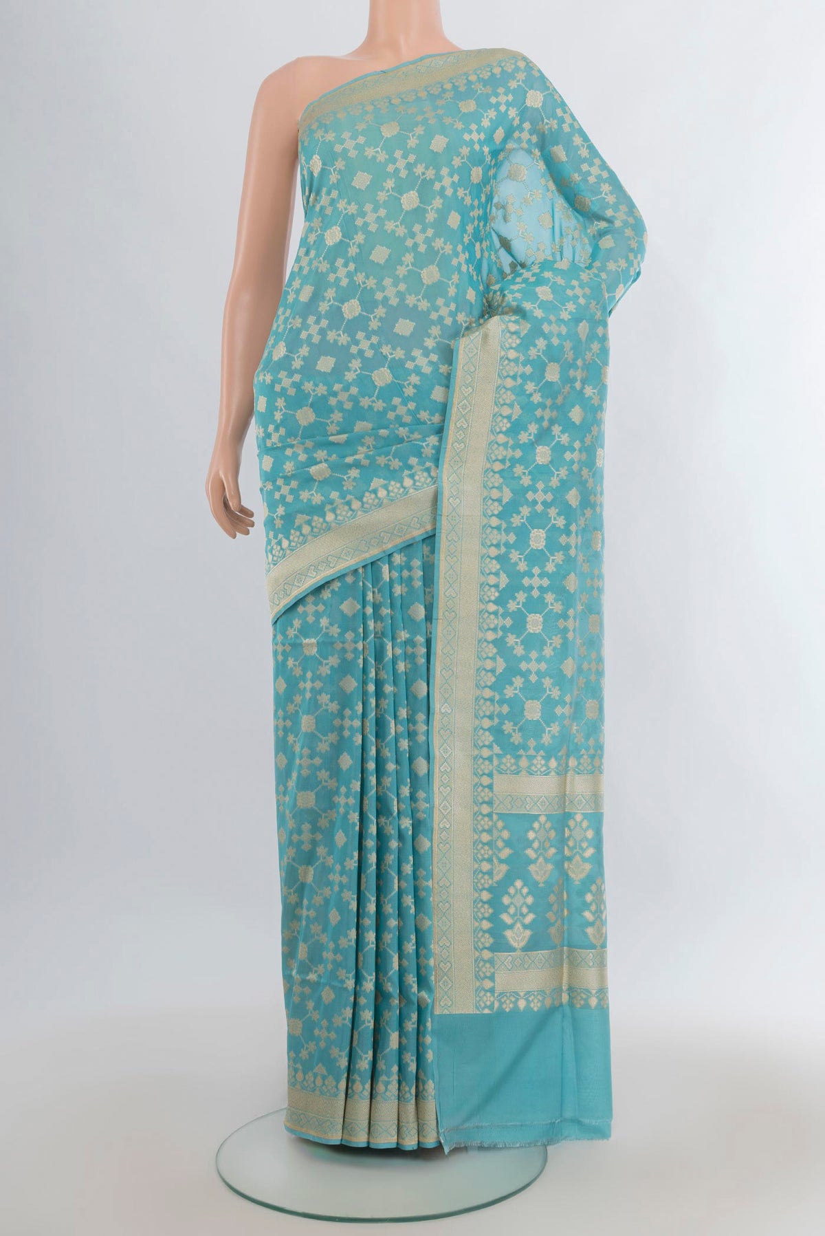 Pure Silk Sky Blue Banarasi Saree with Zari Butta on the body and Zari Border.  displayed on a mannequin