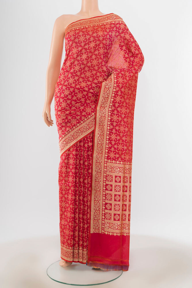 Peach Banarasi Silk Saree with Zari Butta on the body and Silk Border.  displayed on a mannequin