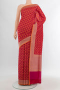 Rani Pink Banarasi Silk Saree with Zari Butta on the body and Zari Border.  displayed on a mannequin