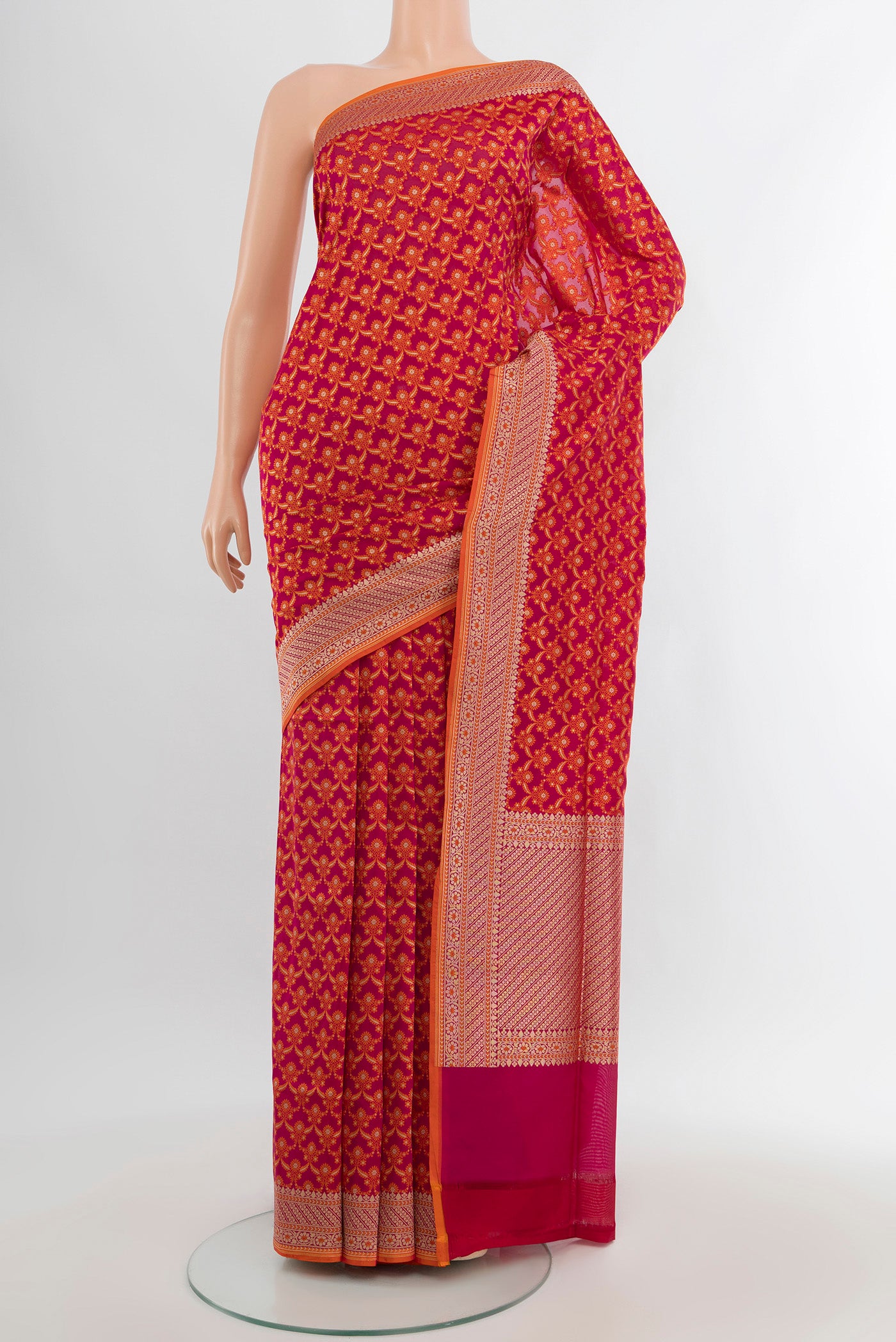 Rani Pink Banarasi Silk Saree with Zari Butta on the body and Zari Border.  displayed on a mannequin