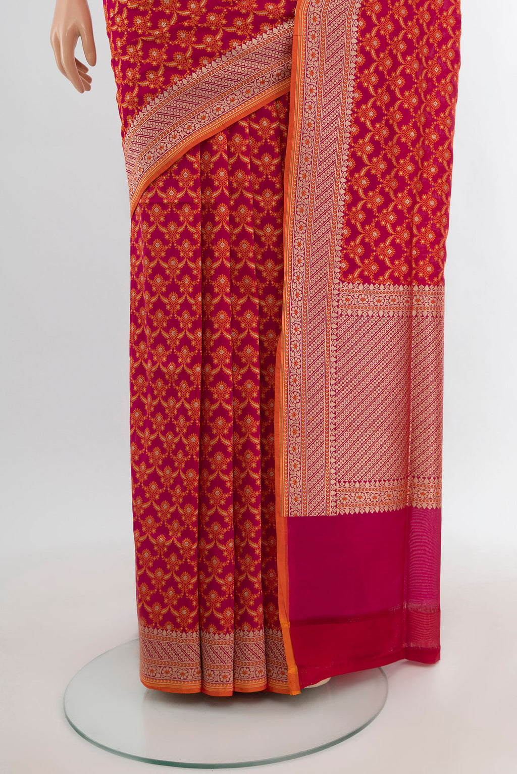 Pleats and pallu of Rani Pink Banarasi Silk Saree with Zari Butta on the body and Zari Border. 