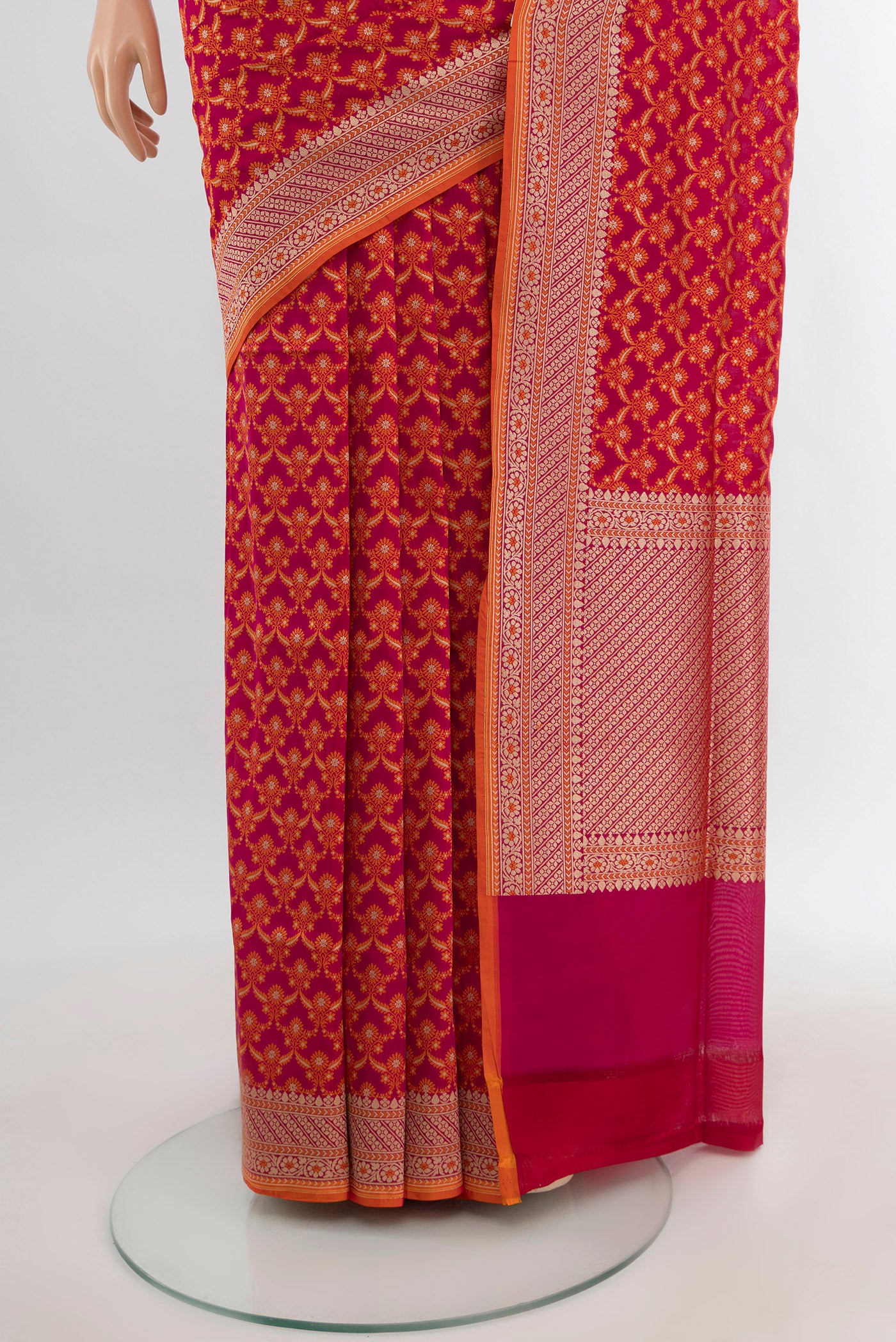 Pleats and pallu of Rani Pink Banarasi Silk Saree with Zari Butta on the body and Zari Border. 