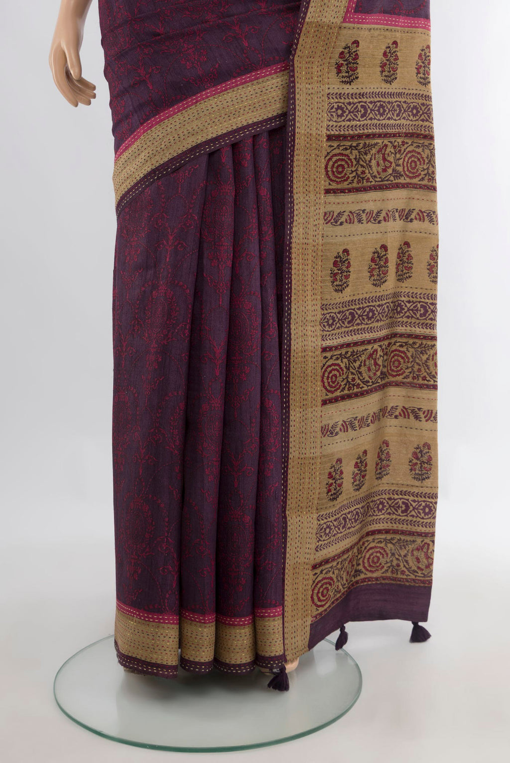 Pleats and pallu of Purple Tussar Saree with Printed design on the body and Embroidery Border. 