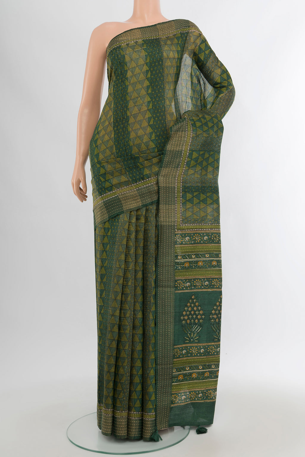 Bottle Green Tussar Silk Saree with Floral Print on the body and Thread Border.  displayed on a mannequin