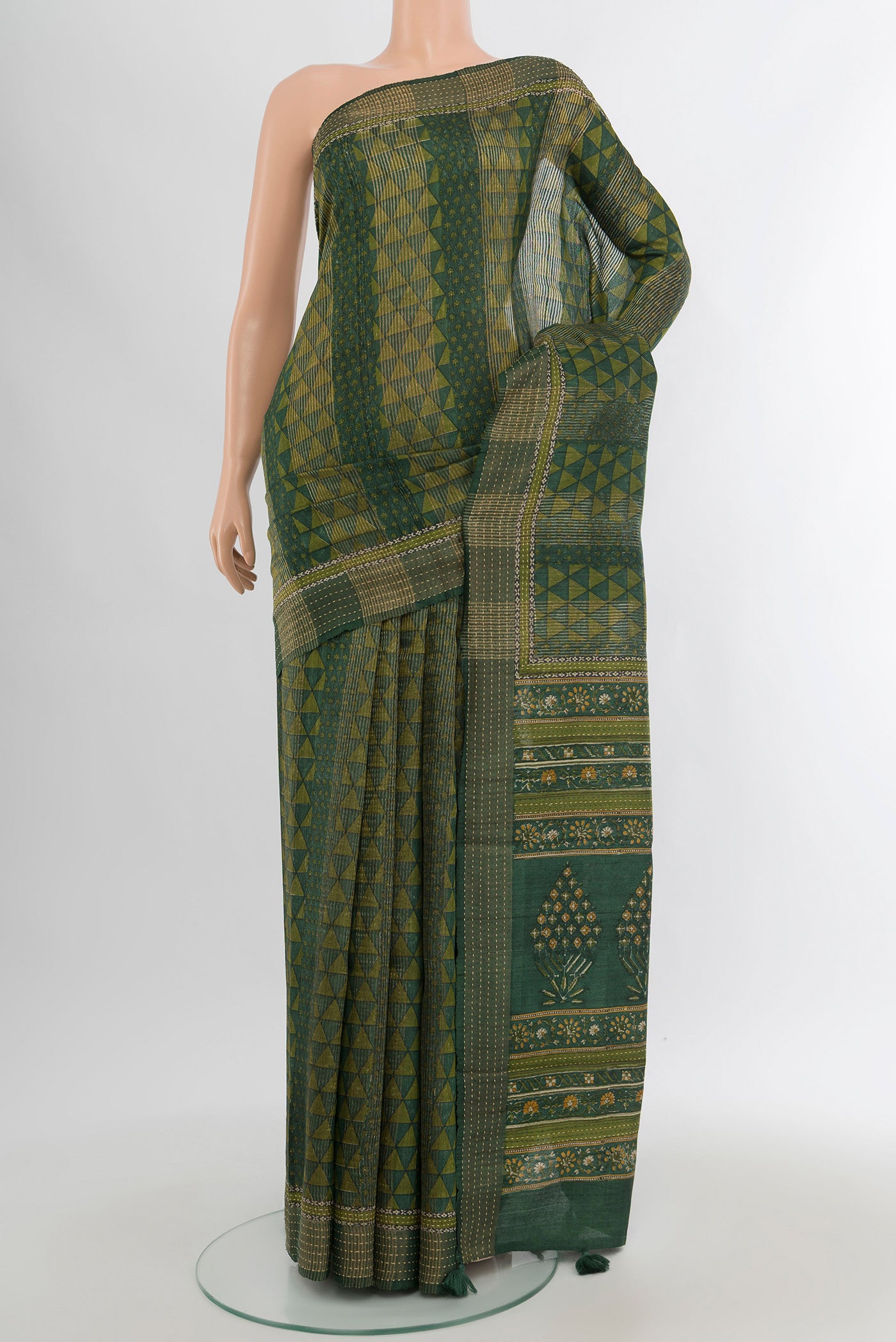 Bottle Green Tussar Silk Saree with Floral Print on the body and Thread Border.  displayed on a mannequin