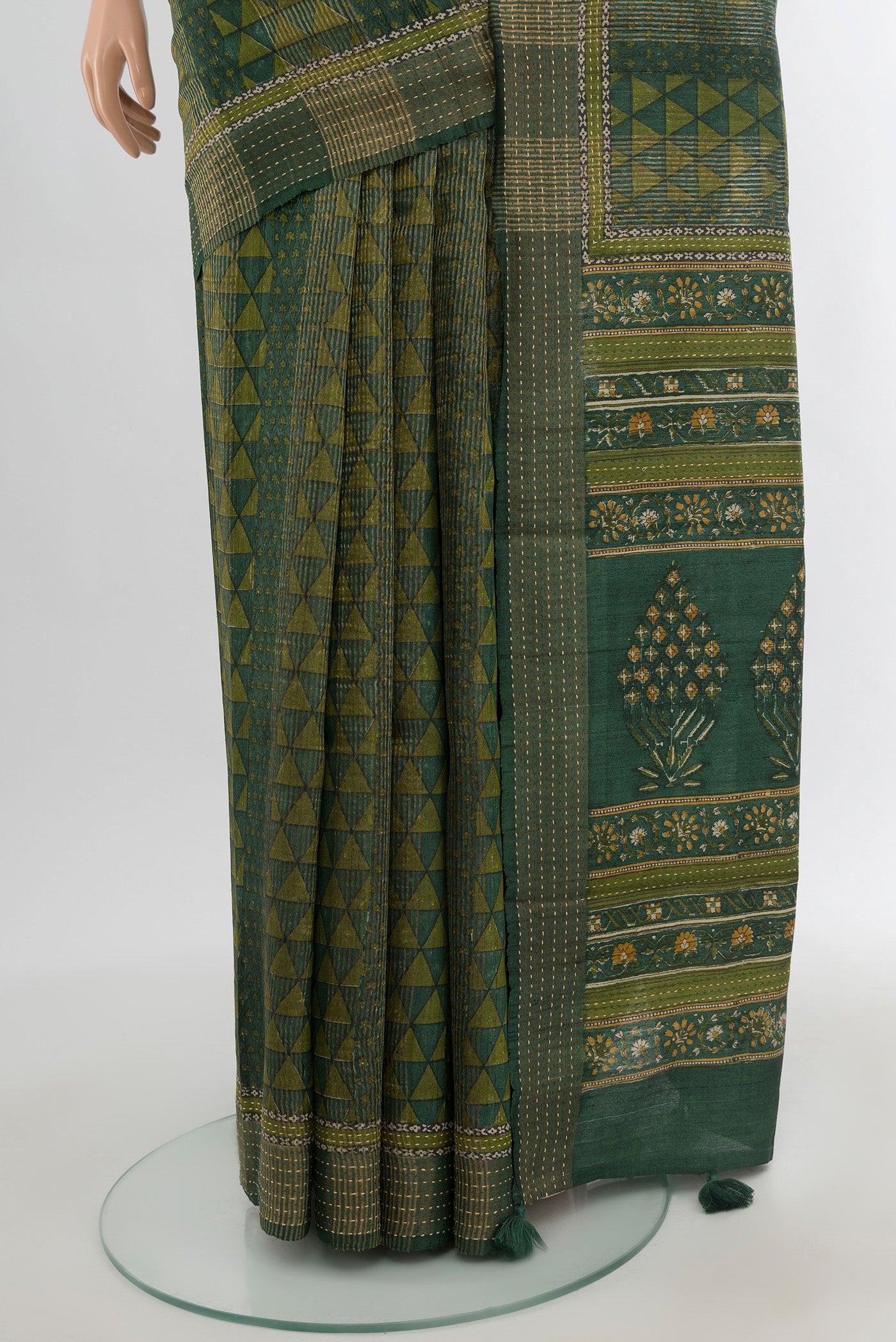 Pleats and pallu of Bottle Green Tussar Silk Saree with Floral Print on the body and Thread Border. 