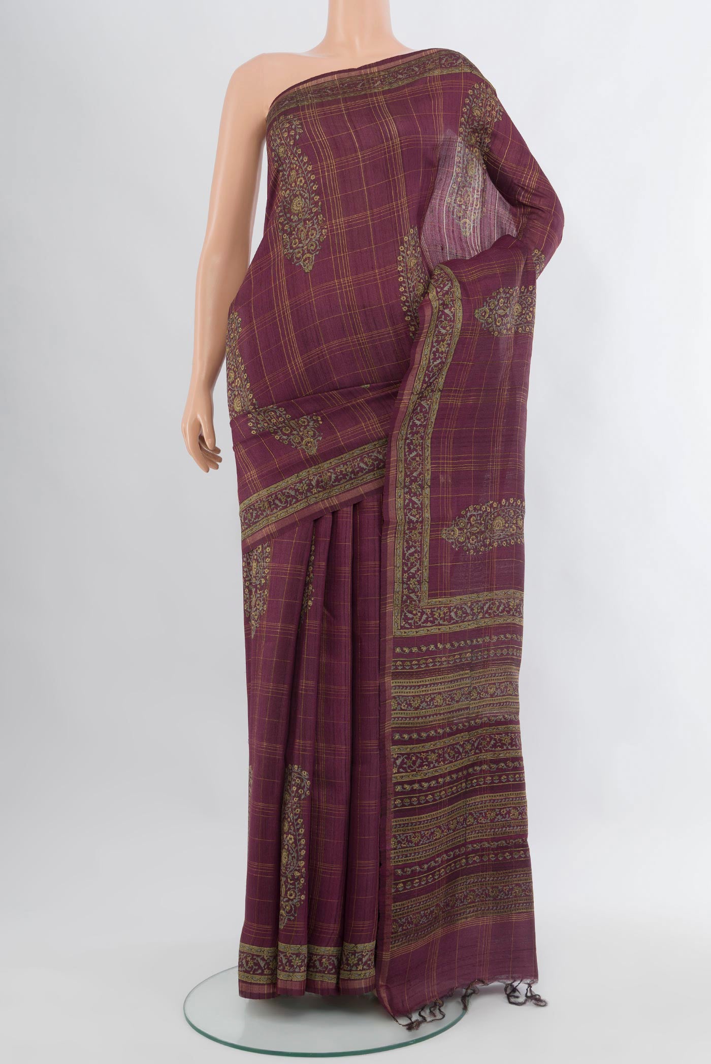 Purple Tussar Silk Saree with Floral Print on the body and Printed Border.  displayed on a mannequin