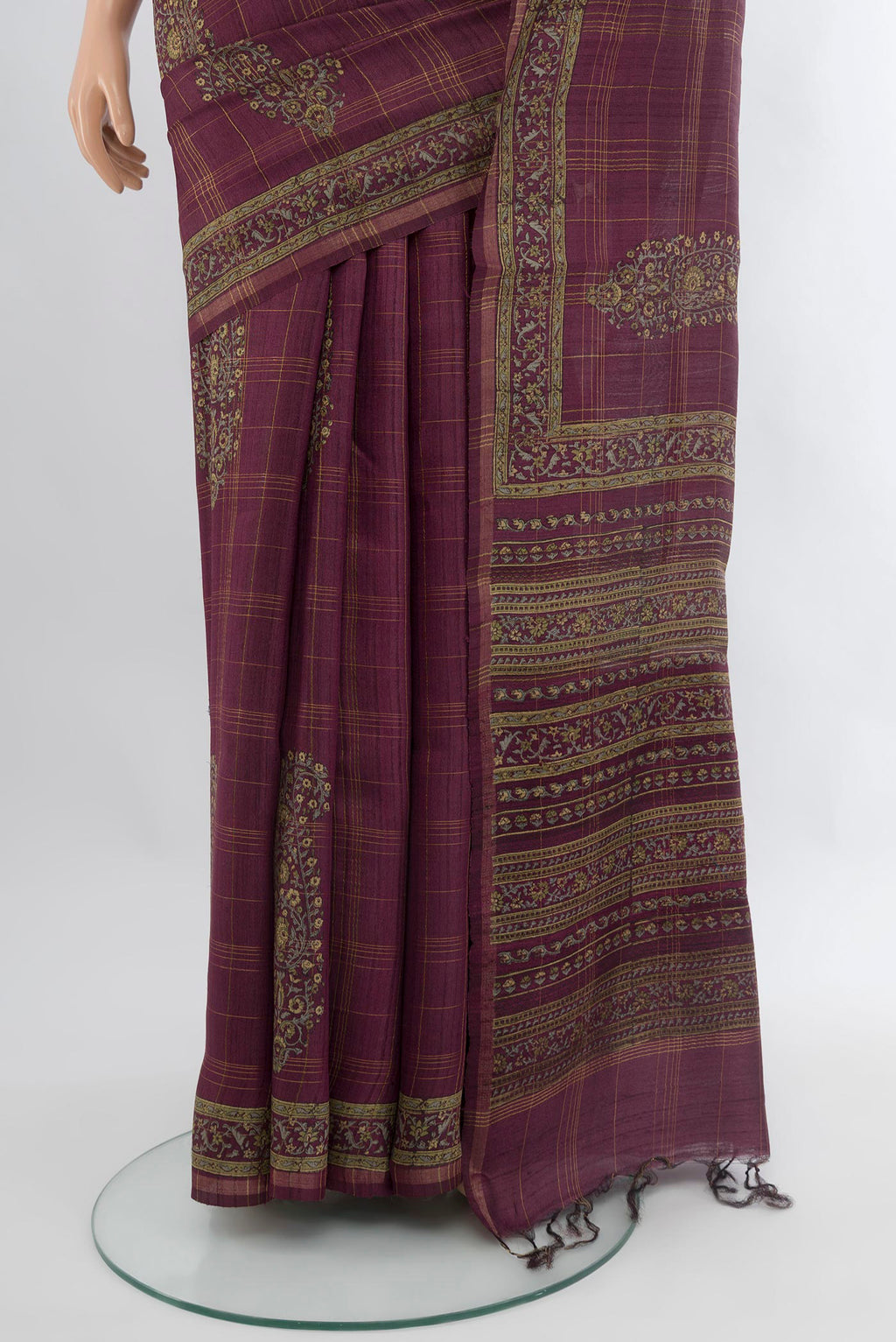 Pleats and pallu of Purple Tussar Silk Saree with Floral Print on the body and Printed Border. 
