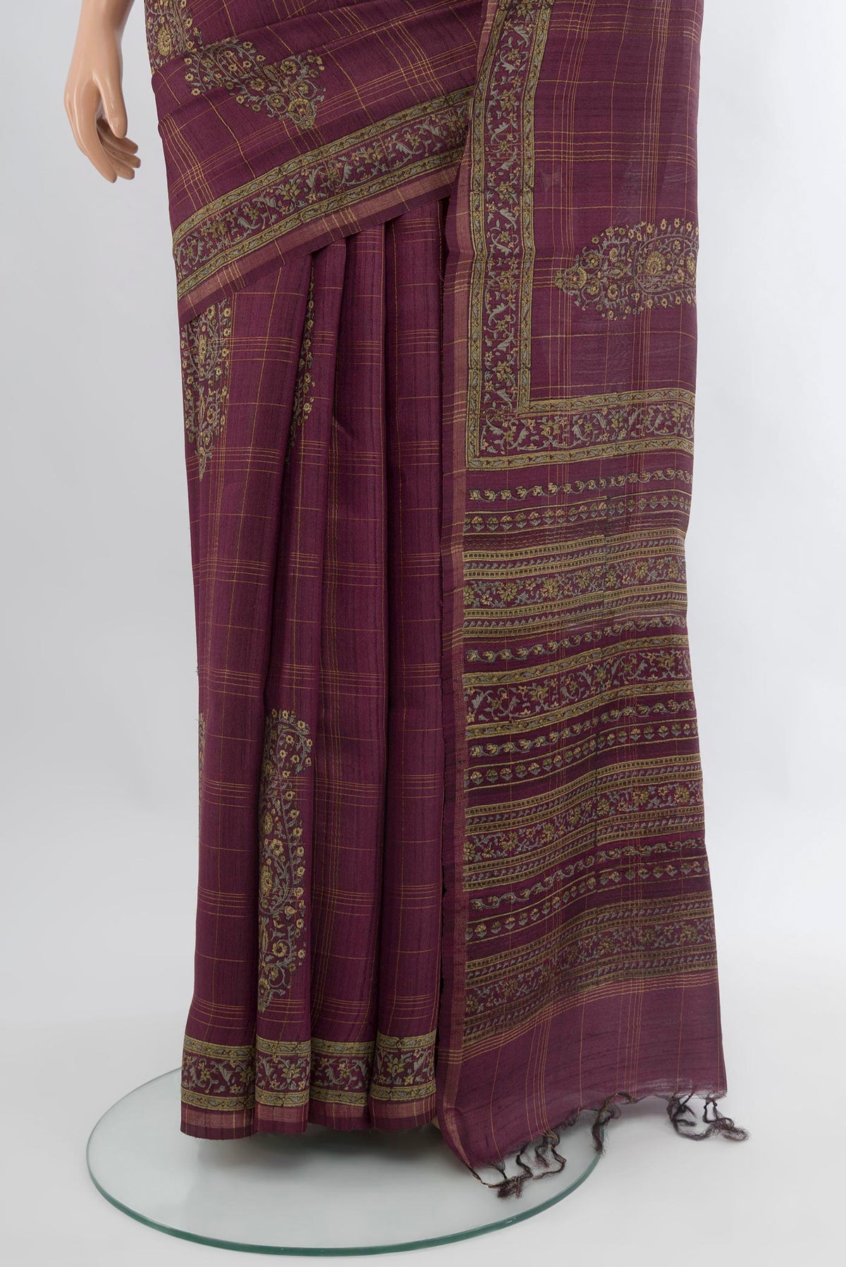 Pleats and pallu of Purple Tussar Silk Saree with Floral Print on the body and Printed Border. 