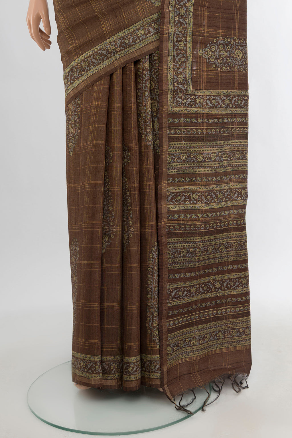 Pleats and pallu of Brown Tussar Silk Saree with Floral Print on the body and Printed Border. 