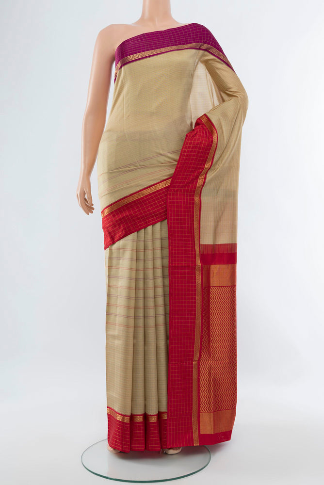 Beige Bangalore Silk - kadyal Saree with Zari Butta on the body and Silk Border.  displayed on a mannequin