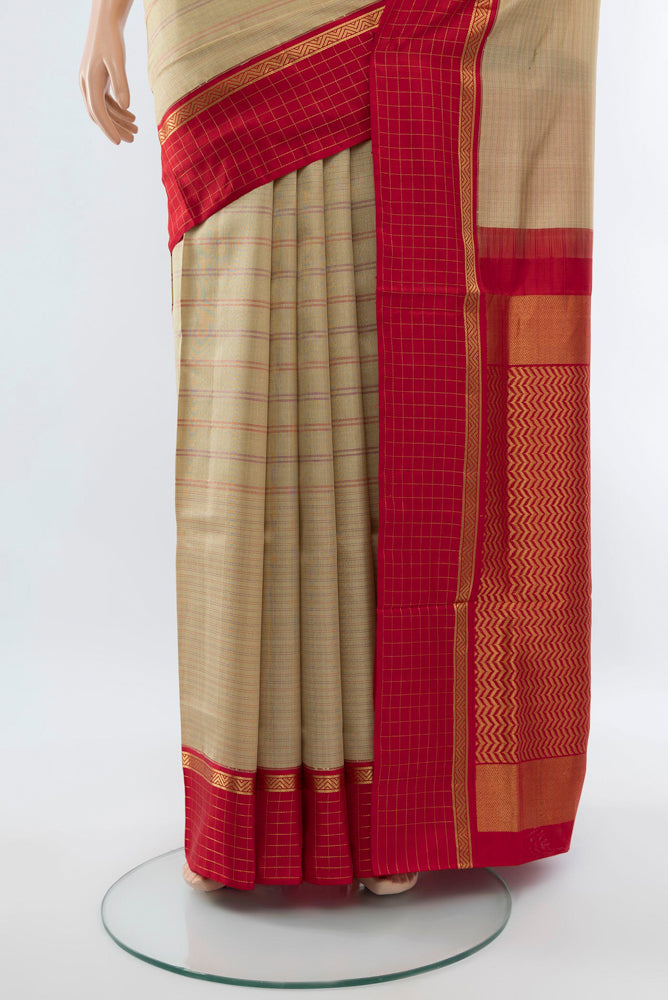 Pleats and pallu of Beige Bangalore Silk - kadyal Saree with Zari Butta on the body and Silk Border. 