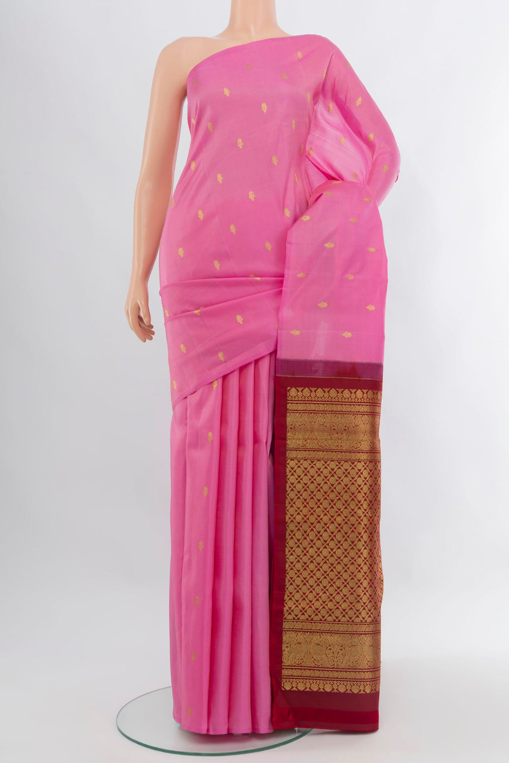 Rose pink Kanchipuram Silk Saree with Zari Butta on the body and Without Border.  displayed on a mannequin