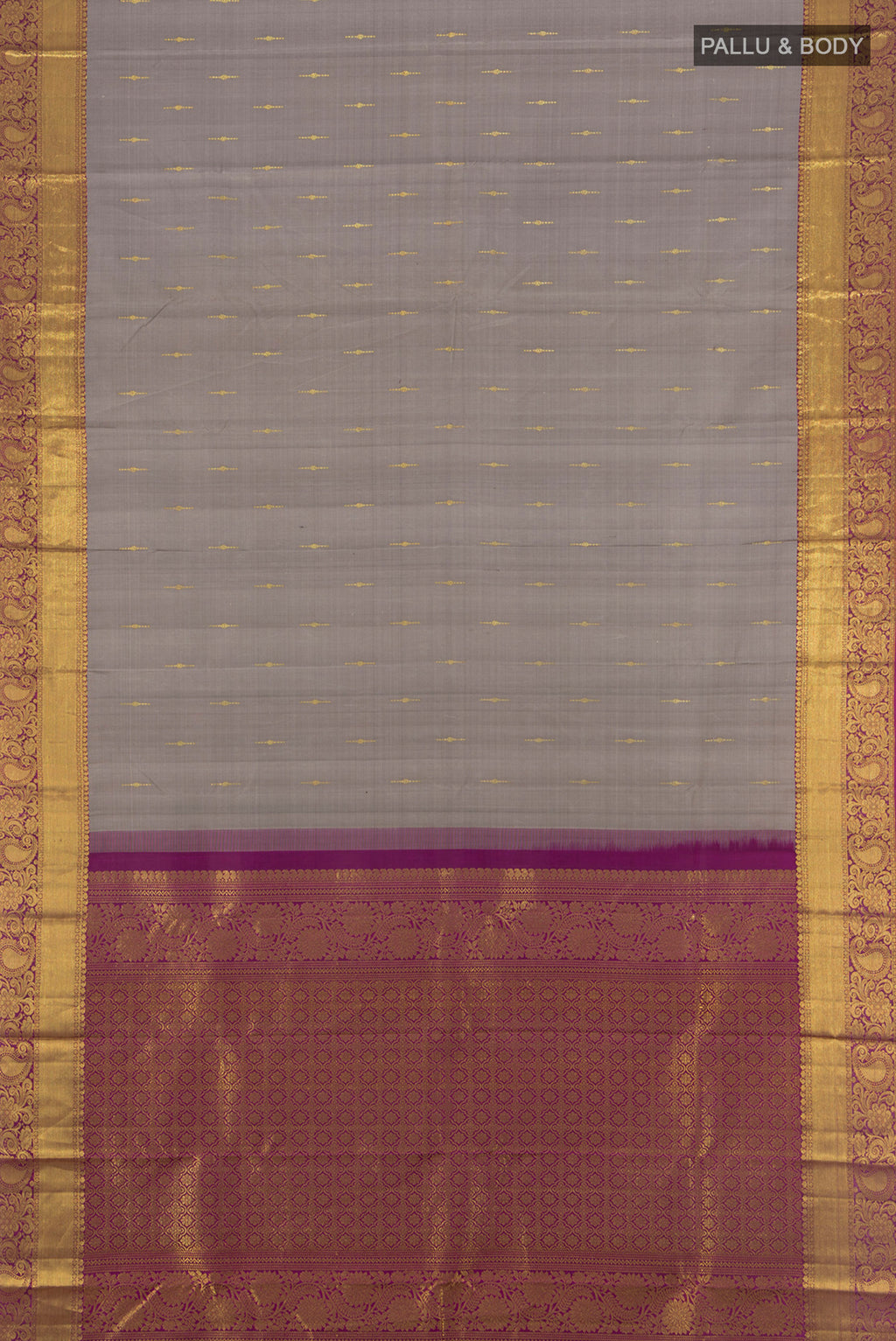 Flat view of Grey Kanchipuram Silk Saree with Zari Butta on the body and Zari Border. 