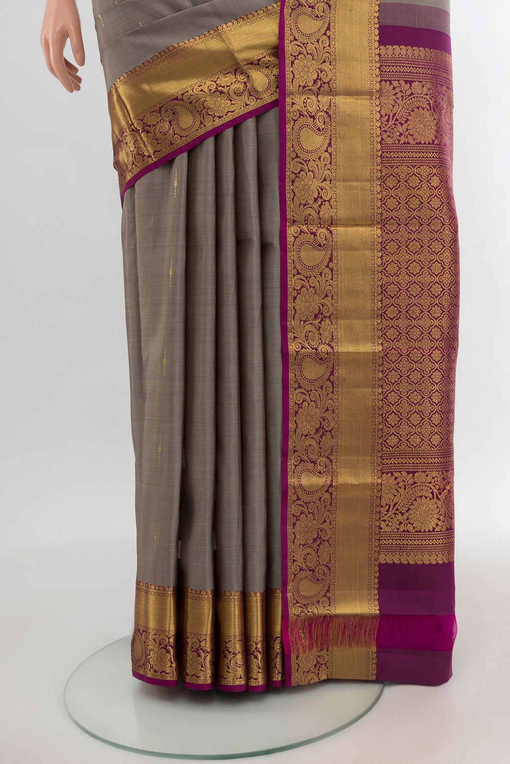 Pleats and pallu of Grey Kanchipuram Silk Saree with Zari Butta on the body and Zari Border. 
