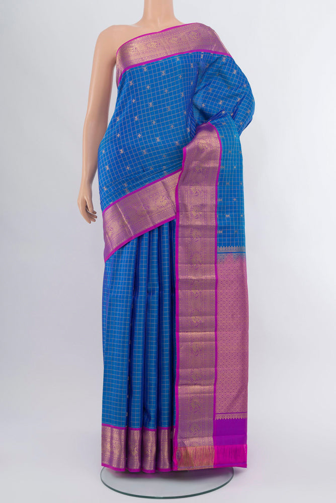 Dark Blue Kanchipuram Silk Saree with Zari Brocade on the body and Silk Border.  displayed on a mannequin