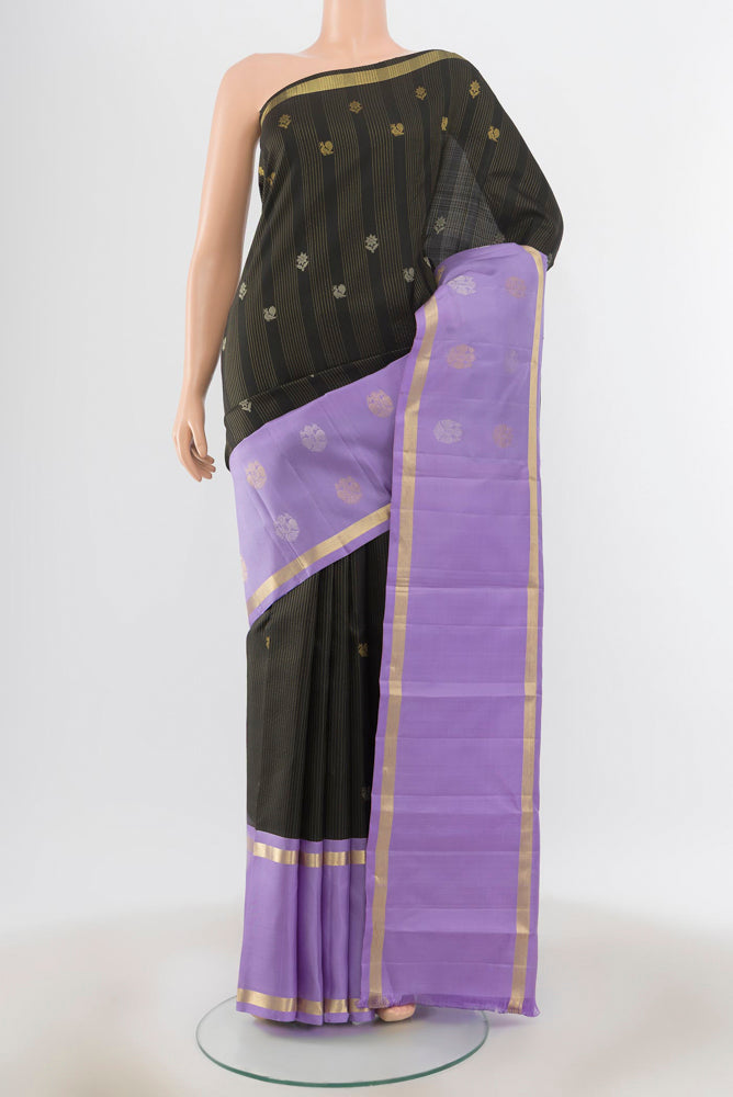 Black Kanjivaram Silk Saree with Zari Butta on the body and Silk Border.  displayed on a mannequin