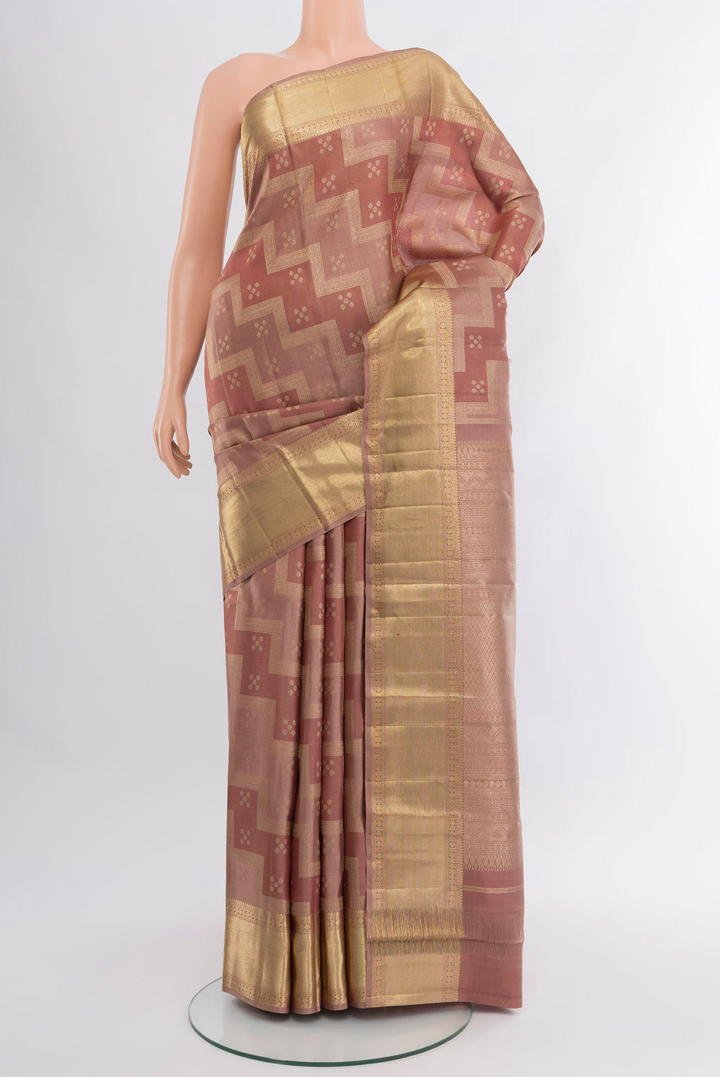 Rose Gold Kanjivaram Silk Saree with Zari Brocade on the body and Zari Border.  displayed on a mannequin