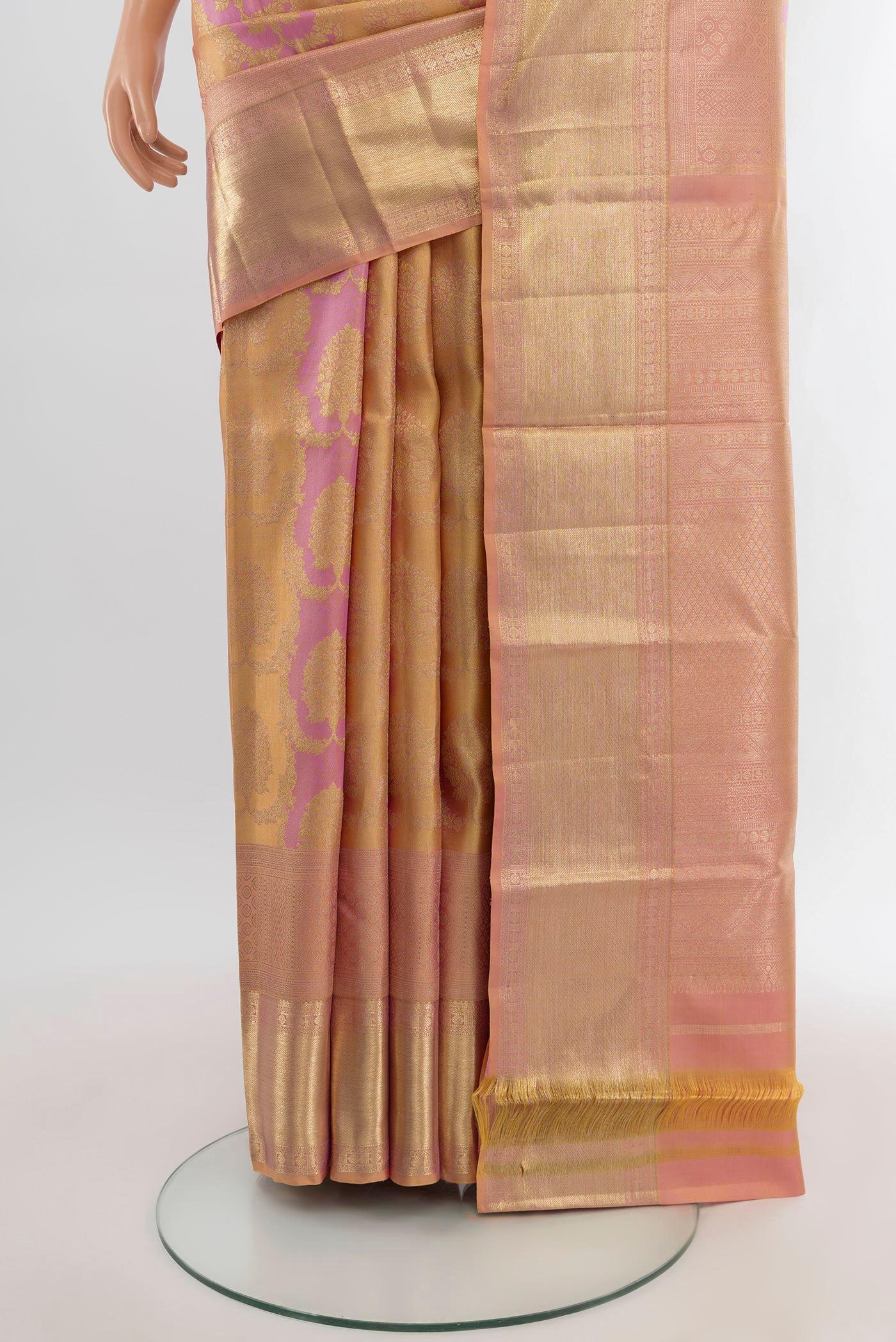 Pleats and pallu of Peach Kanjivaram Silk Saree with Zari Brocade on the body and Zari Border. 