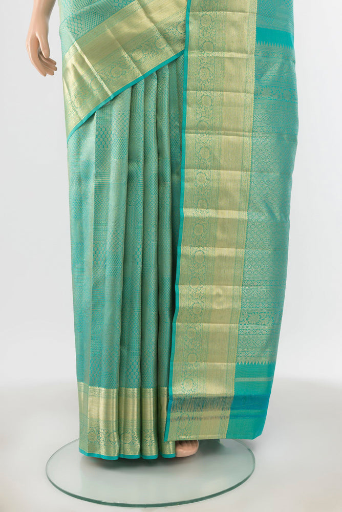Pleats and pallu of Sky Blue Kanjivaram Silk Saree with Zari Butta on the body and Silk Border. 