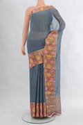 Blue Mysore Georgette Saree with Plain Body and Zari Border.  displayed on a mannequin