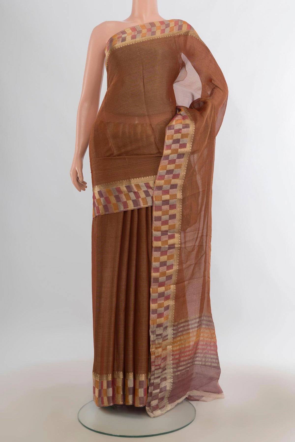 Bronze Mysore Georgette Saree with Plain Body and Fancy Border.  displayed on a mannequin