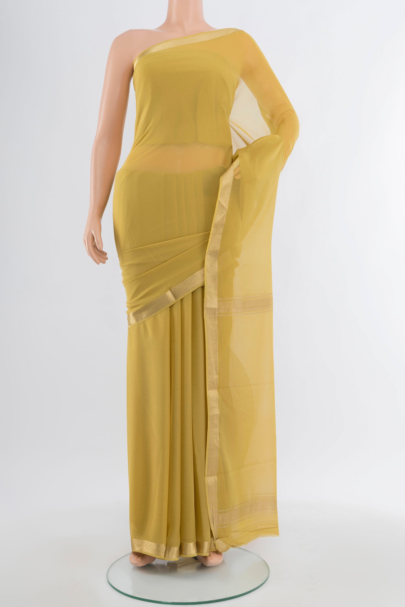 Light Green Mysore Georgette Saree with Plain Body and Silk Border.  displayed on a mannequin