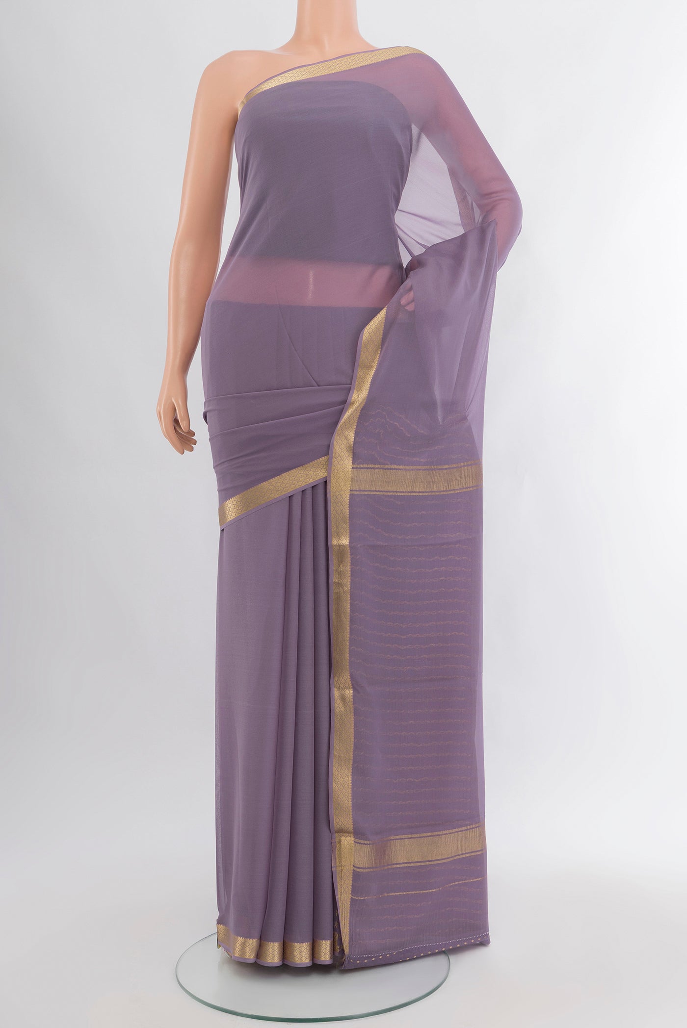 Lavender Mysore Georgette Saree with Plain Body and Zari Border.  displayed on a mannequin