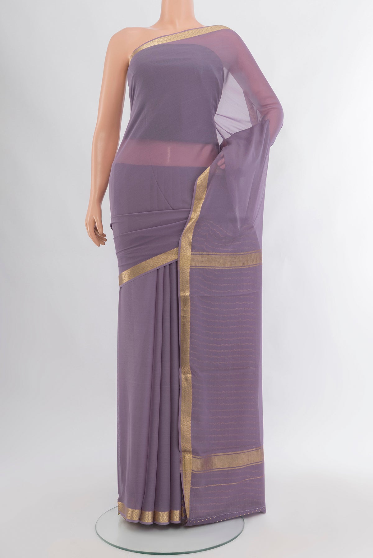 Lavender Mysore Georgette Saree with Plain Body and Zari Border.  displayed on a mannequin