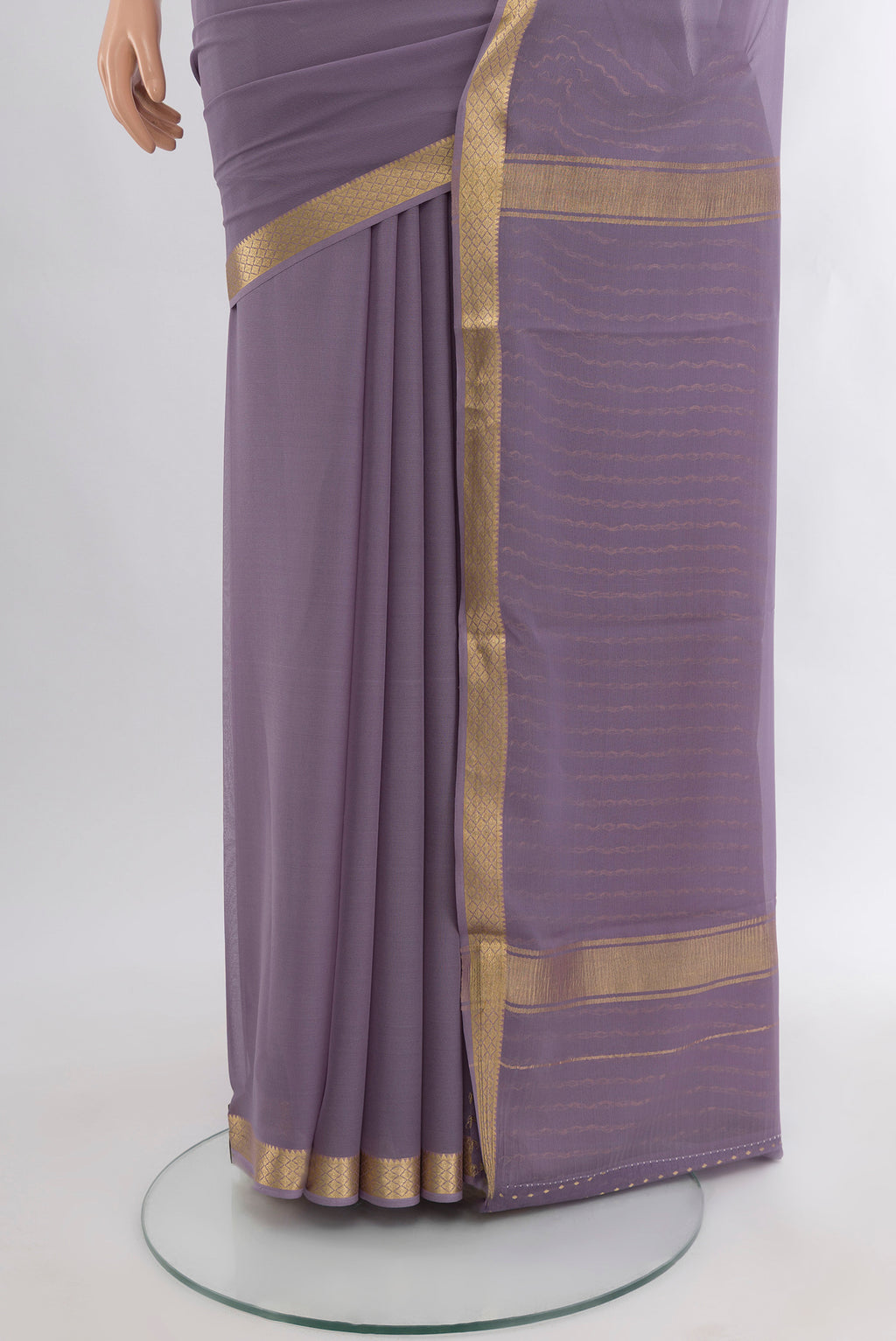 Pleats and pallu of Lavender Mysore Georgette Saree with Plain Body and Zari Border. 