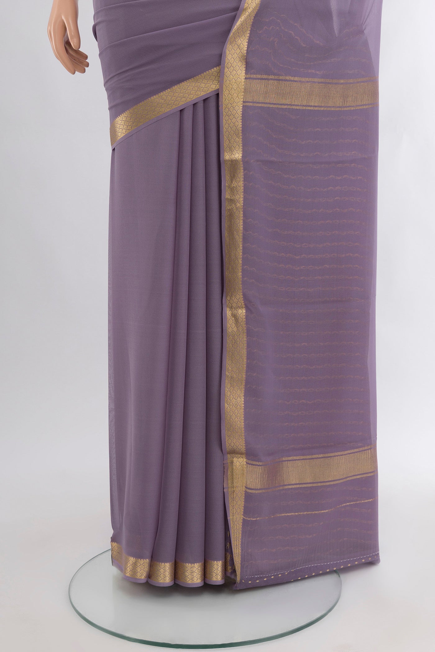 Pleats and pallu of Lavender Mysore Georgette Saree with Plain Body and Zari Border. 