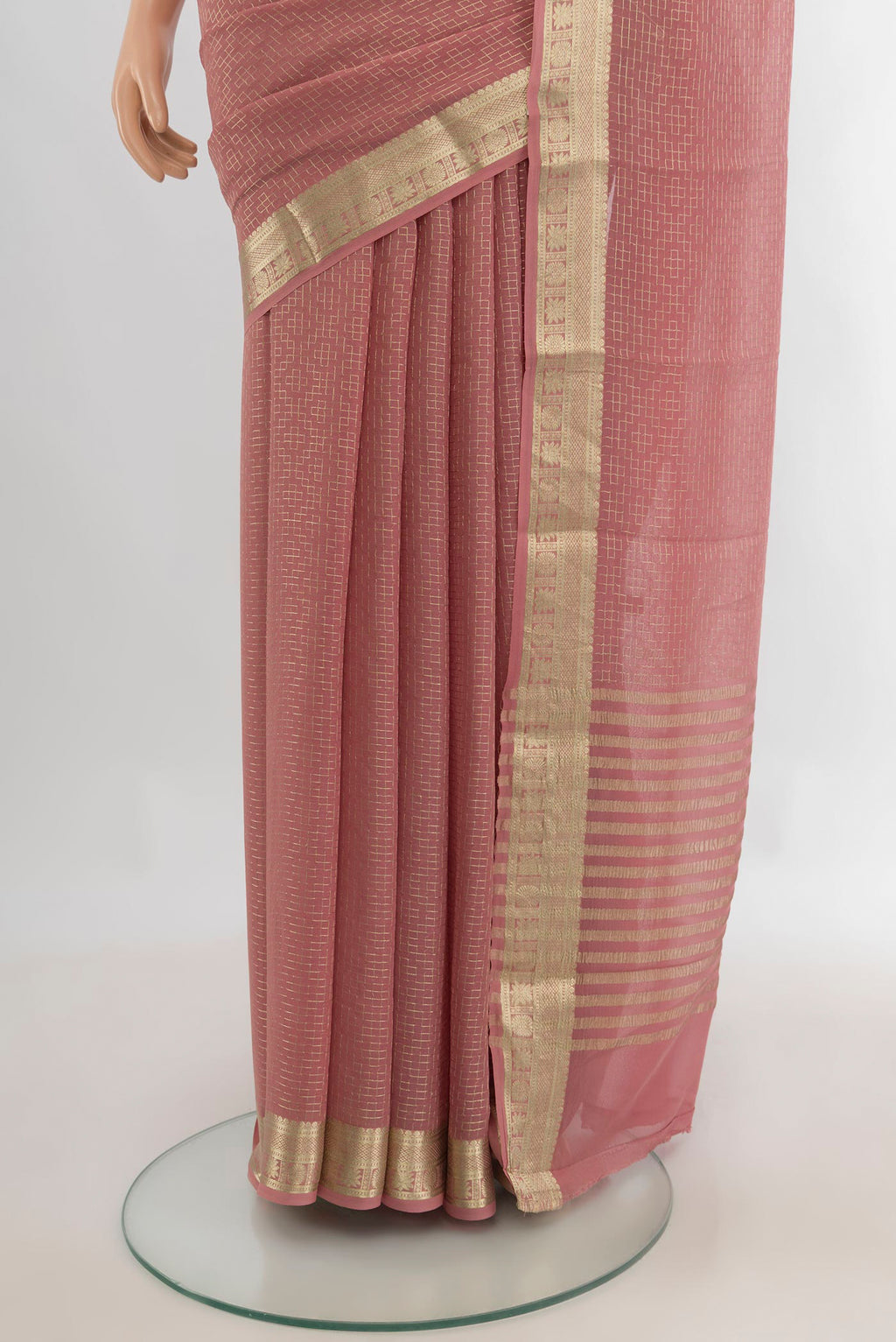 Pleats and pallu of Rose Gold Mysore Georgette Saree with Embroidery on the body and Zari Border. 