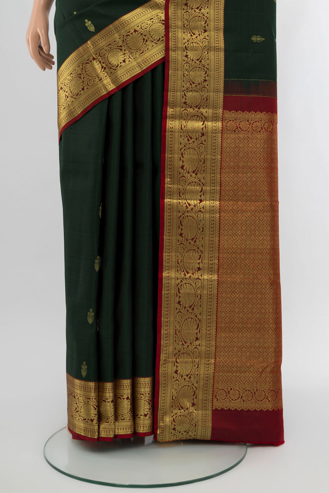 Pleats and pallu of Mint Green Kanchipuram Silk Saree with Zari Butta on the body and Silk Border. 