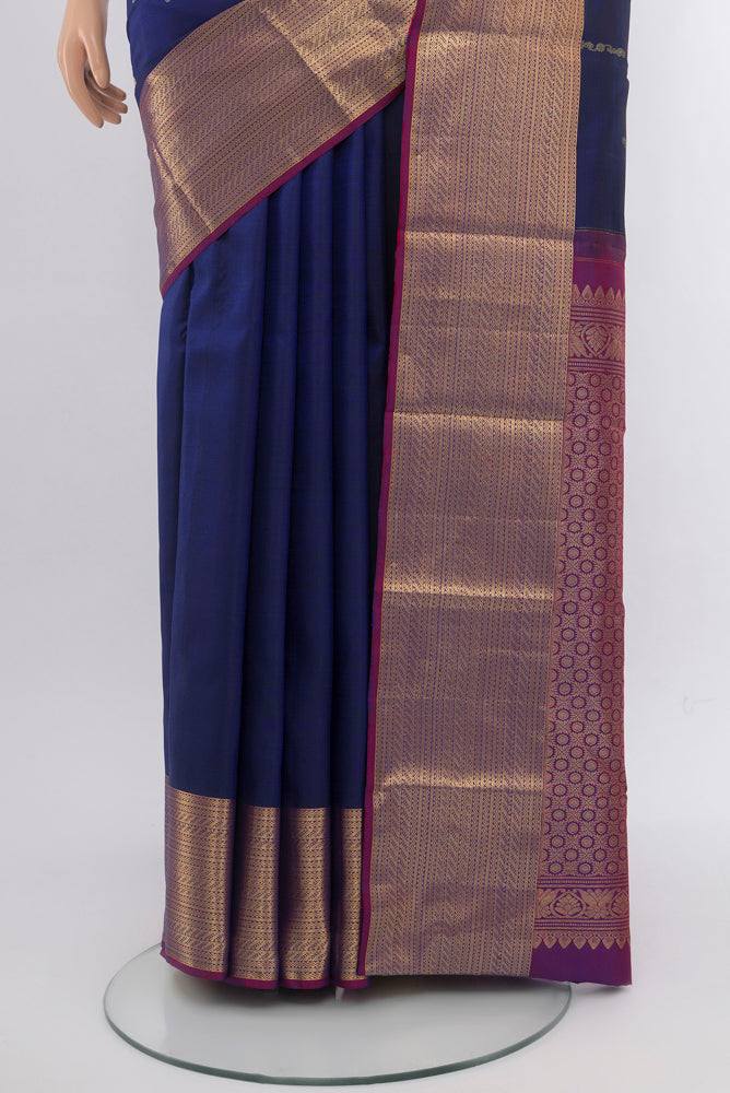 Pleats and pallu of Dark Blue Kanchipuram Silk Saree with Checked design on the body and Silk Border. 